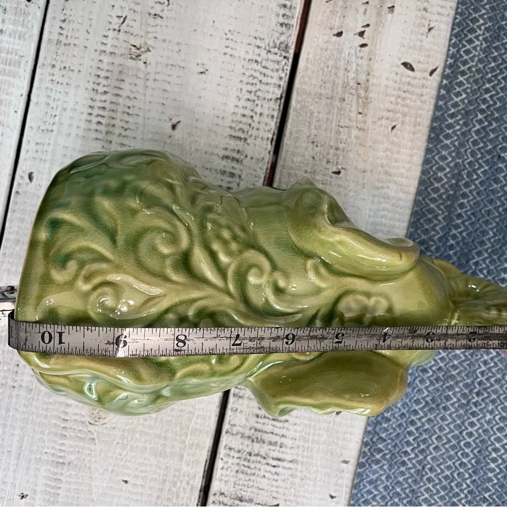 Elephant ceramic- Green Glaze Sitting with Floral Design 10 1/2” euc